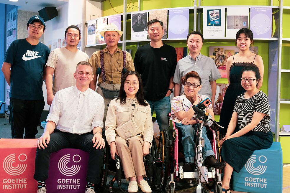 Lynn Fu (first to the right in the first row) with accessibility consultants