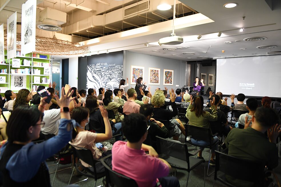 Audience applauding in sign language at “EYEth Art” artist talk 2020