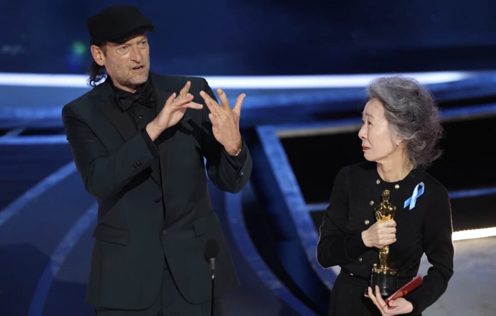 Troy Kotsur (left) made his acceptance speech at the Oscars ceremony in sign language, while the award presenter, Korean actress Youn Yuh-Jung, held his Best Supporting Actor trophy during the speech. 